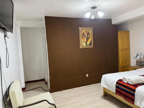 Postel nebo postele na pokoji v ubytování Hotel Plateros
