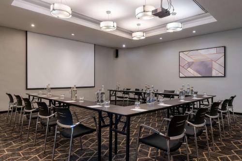 a conference room with a large table and chairs at Radisson Lagos Ikeja in Lagos