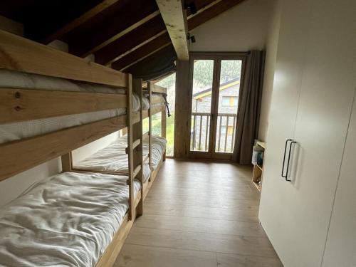 two bunk beds in a room with a hallway at Chalet en la Cerdanya in Latour-de-Carol