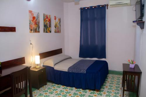 Postel nebo postele na pokoji v ubytování Hotel Cortaza Galería