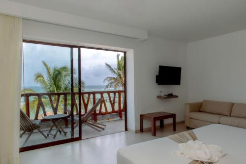 a living room with a view of the ocean at Quinto Sole in Mahahual