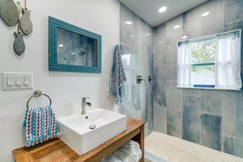 a bathroom with a sink and a shower at Pet-Friendly Cocoa Beach Home Walk to Beach! in Cocoa Beach