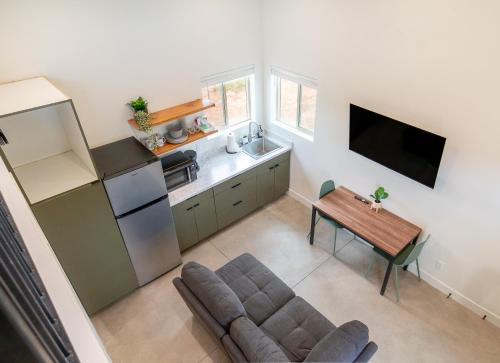 a kitchen with a couch and a table in a room at Casitas at Capitol Reef in Torrey