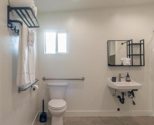 a bathroom with a toilet and a sink at Casitas at Capitol Reef in Torrey
