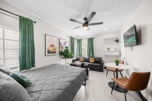 a bedroom with a bed and a couch at Baybreeze Apartments by Lowkl in Miami Beach