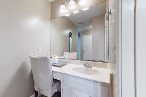 a bathroom with a sink and a large mirror at Mapp to Paradise in Destin