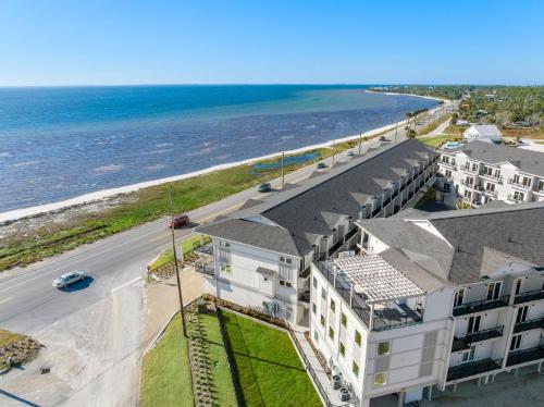 an aerial view of a building next to the ocean at Beach View Lower by Pristine Properties Vacation Rentals in Mexico Beach