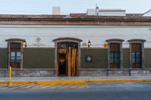 a building with a door on the side of it at Hotel Casa Tequis San Luis Potosi in San Luis Potosí