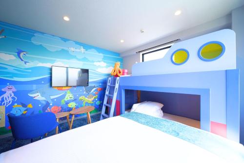 a bedroom with a bunk bed with a fish mural at PLAY!! Resi Stay in Kyoto