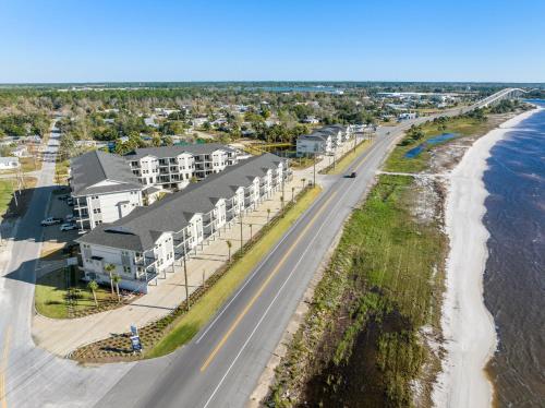 an aerial view of a beach with condos at Embreeze Beach Casa by Pristine Properties Vacation Rentals in Highland View