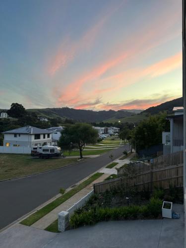 a view of a street at sunset from a house at Surfleet Retreat Kiama in Kiama
