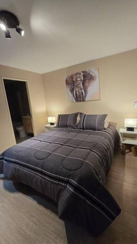 En eller flere senge i et værelse på Dpto Nuevo Centro Osorno