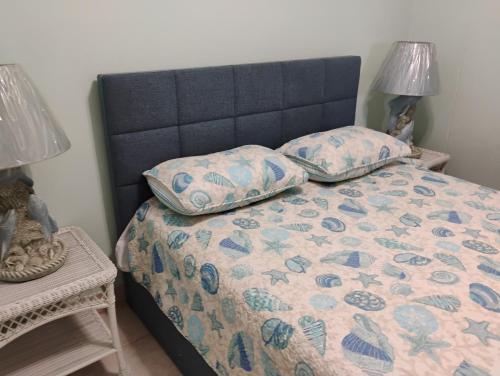 a bedroom with a bed with two pillows on it at Belleview Gulf Condos in Clearwater Beach