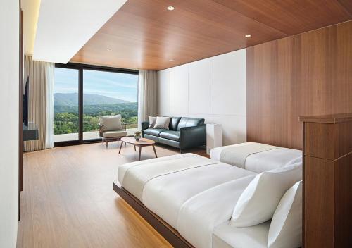 Postel nebo postele na pokoji v ubytování Hanwha Resort Gyeongju