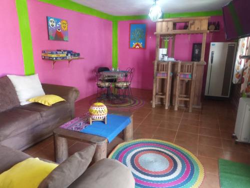 a living room with a couch and a table at AranCalli, hospedaje en cabañas in Ozumba de Alzate