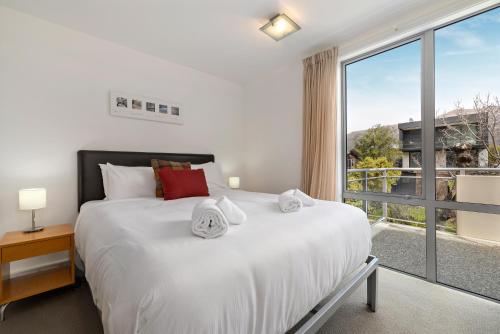 Ένα ή περισσότερα κρεβάτια σε δωμάτιο στο Belvedere Brook Apartment
