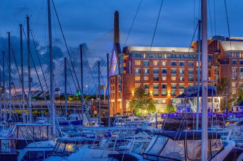 a group of boats docked in a marina at night at Residence Inn by Marriott Boston Harbor on Tudor Wharf in Boston