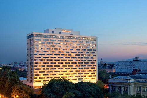 a building with a hotel sign on top of it at The Westin Zagreb in Zagreb
