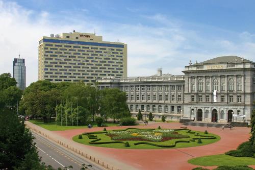 a large building with a park in front of it at The Westin Zagreb in Zagreb