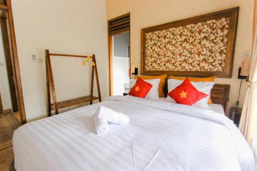 Кровать или кровати в номере Villa D'Maguwo Suites
