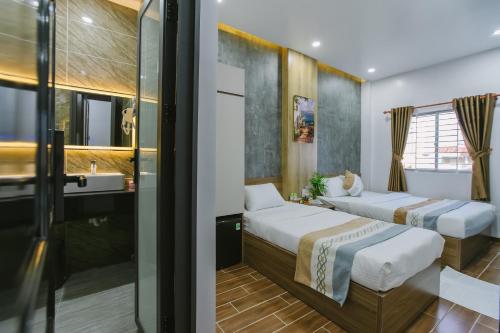 Postel nebo postele na pokoji v ubytování Peony Hotel