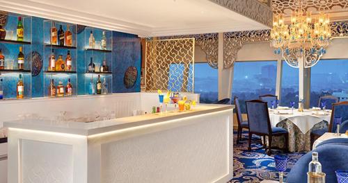 a bar in a restaurant with a view at The Golkonda Resort and Spa in Hyderabad