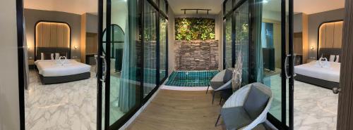 Postel nebo postele na pokoji v ubytování Blooming resort buriram บลูมมิ่ง รีสอร์ท บุรีรัมย์