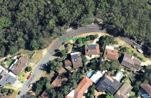 an overhead view of a house with houses and trees at Tree Tops Studio Bangor in Bangor