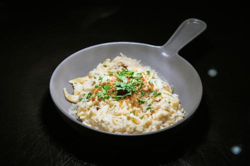 a bowl of rice with a spoon on a table at Sheraton Frankfurt Airport Hotel & Conference Center in Frankfurt/Main