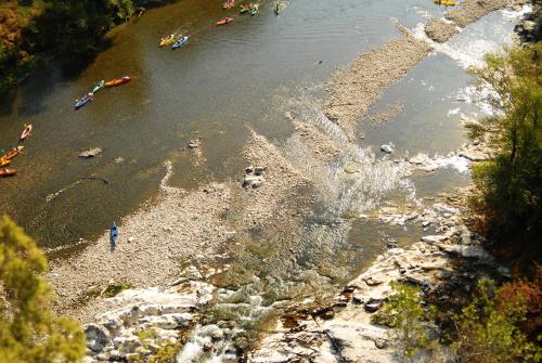 an aerial view of a river with people on the shore at Rev'ôthijol Vacances in Saint Alban Auriolles