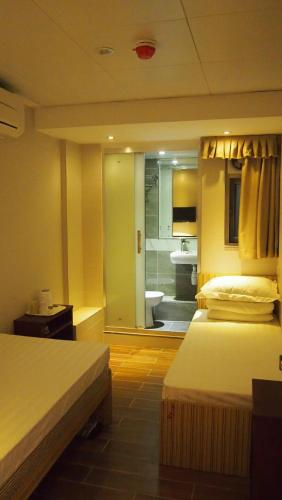 香港金門賓館 KamMun Guest Houseにあるベッド
