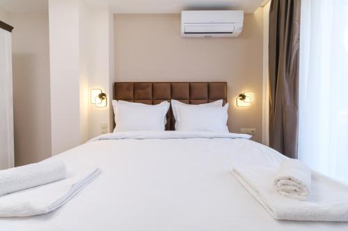 Ένα ή περισσότερα κρεβάτια σε δωμάτιο στο LDV 13 Apartments Free private parking