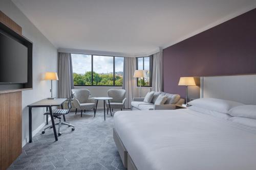 a hotel room with a bed and a living room at Delta Hotels by Marriott Bristol City Centre in Bristol