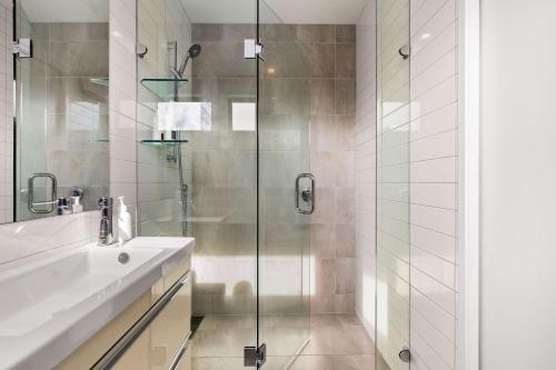 a bathroom with a sink and a shower at Apartments on Upton in Wanaka