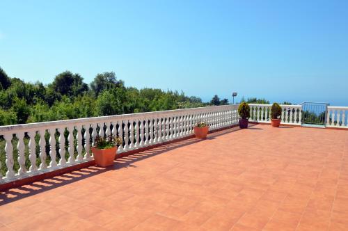 a balcony with potted plants and a fence at Iturritxo Landetxea in Donostia-San Sebastián