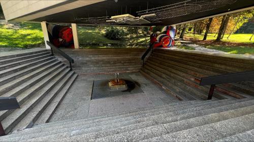 a set of stairs leading up to a bus at Hotel Palace - KÚPELE SLIAČ in Sliač