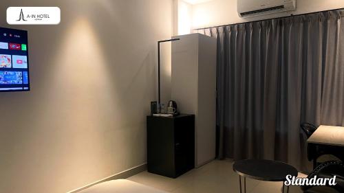 TV a/nebo společenská místnost v ubytování A In Hotel Riverside