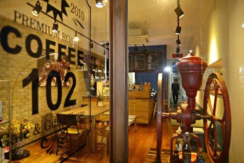 a coffee shop with a fire hydrant in a window at OP 102 Guesthouse in Gyeongju