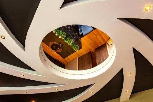 a spiral staircase in a building with a circular ceiling at Escapade 007 Refuge d Agent in Blois