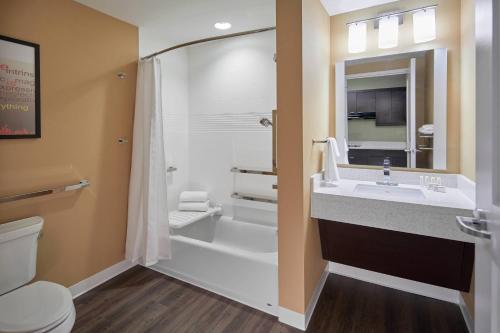 a bathroom with a sink and a shower and a toilet at TownePlace Suites by Marriott Columbus North - OSU in Columbus