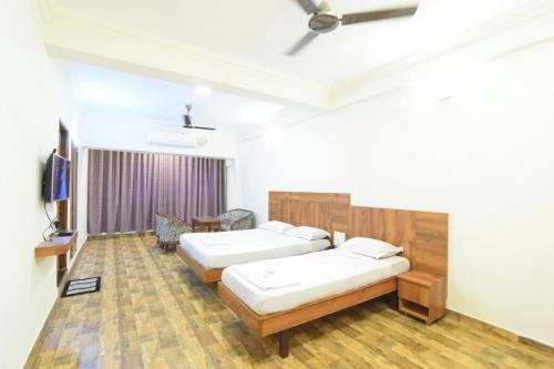 Postel nebo postele na pokoji v ubytování Hotel Swadesh Heritage