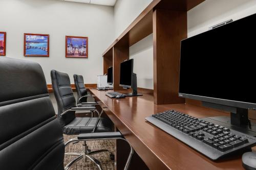 a conference room with a desk with a computer on it at The Westin Desert Willow Villas, Palm Desert in Palm Desert