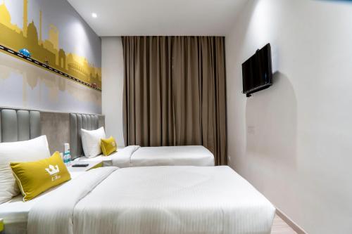 Ένα ή περισσότερα κρεβάτια σε δωμάτιο στο Hotel Le Roi Express Karol Bagh