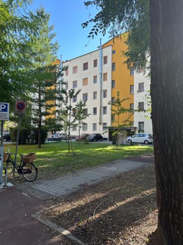 a bike parked on a sidewalk next to a building at Ripalta House in San Donato Milanese