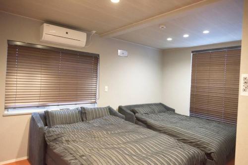 Ένα ή περισσότερα κρεβάτια σε δωμάτιο στο SapporoCity Ark Coat 302 LuxuryRoom