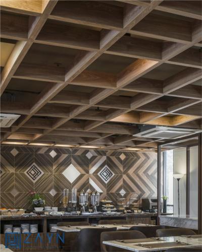 a dining room with a ceiling with wooden beams at Zayn Express & Suites in Bangkok