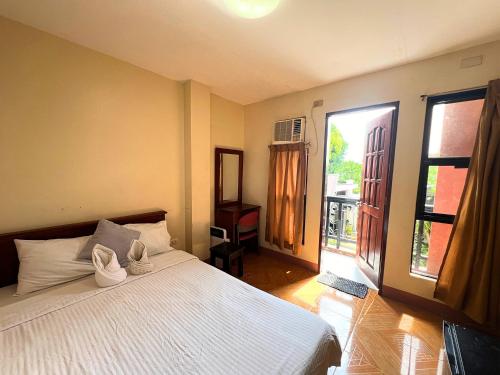 Postel nebo postele na pokoji v ubytování Manora Apartment