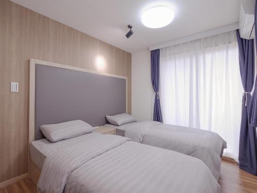 Cama ou camas em um quarto em シティパール桜新町 渋谷新宿自由が丘に便利なアクセス
