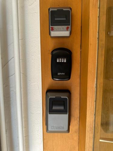 an atm machine with two monitors on a door at Studio Villa Anna in Davos