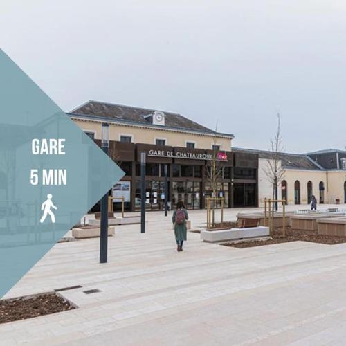 a person walking in front of a building at Le Berry Soft - Spacieux & Chaleureux - Proche Gare in Châteauroux